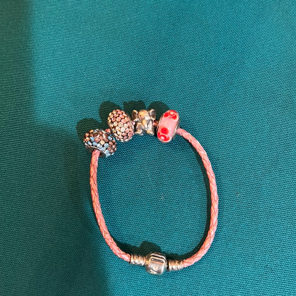Pink Pandora four charm bracelet with a silver elephant